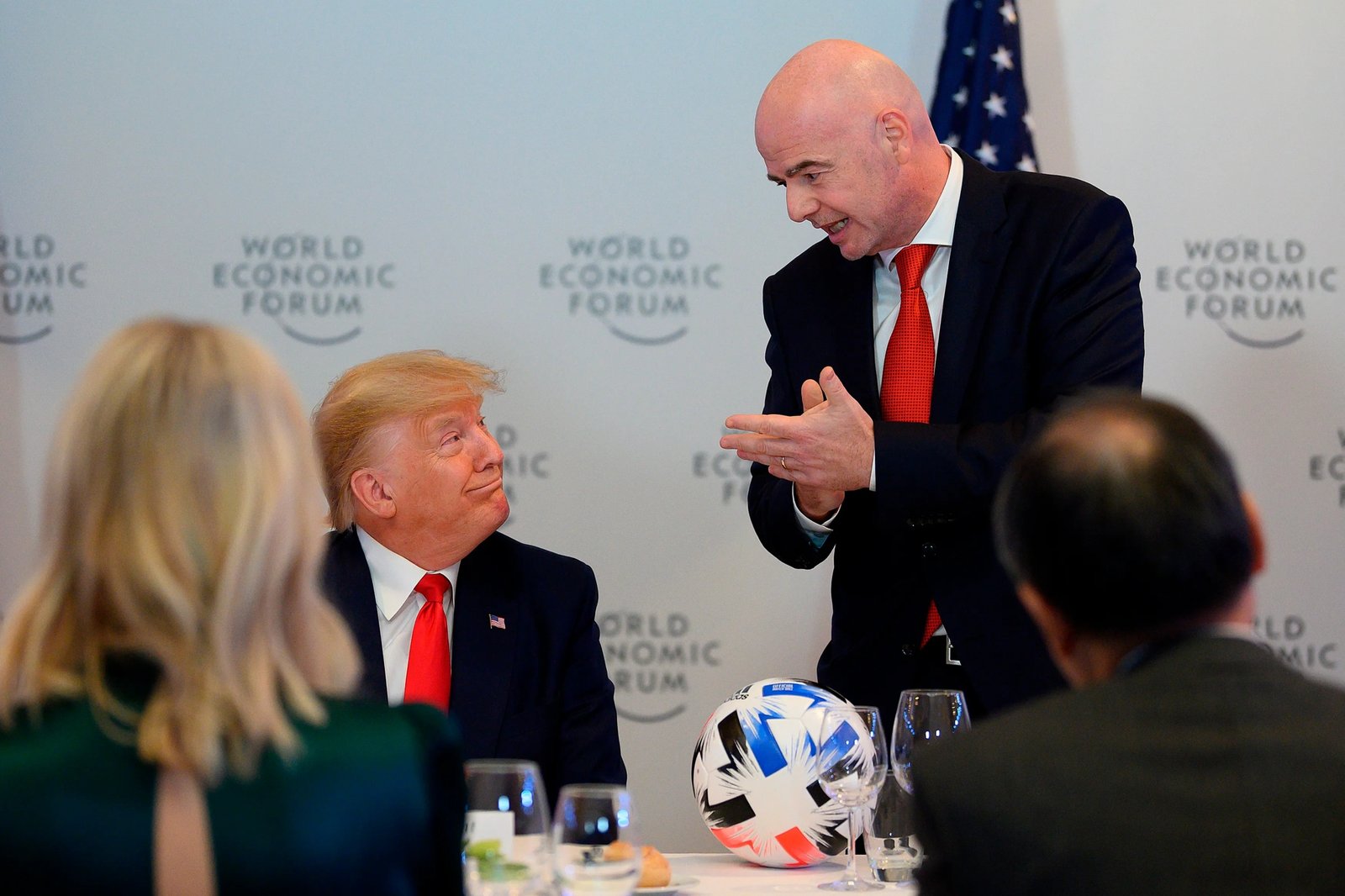 President Trump speaks with FIFA President Gianni Infantino during the Global Chief Executive Officers dinner at the World Economic Forum in Davos