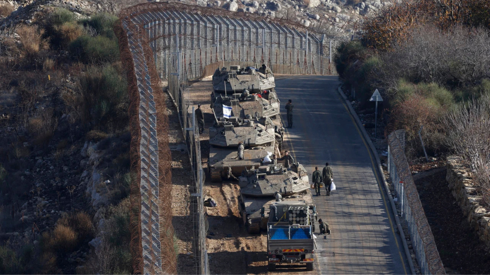 Israeli tanks take position on the border with Syria near the village of Majdal Shams in the Israel-occupied Golan Heights on December 8, 2024 (AFP)